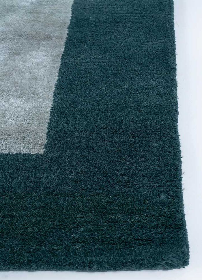 linear blue wool and viscose hand tufted Rug - Corner